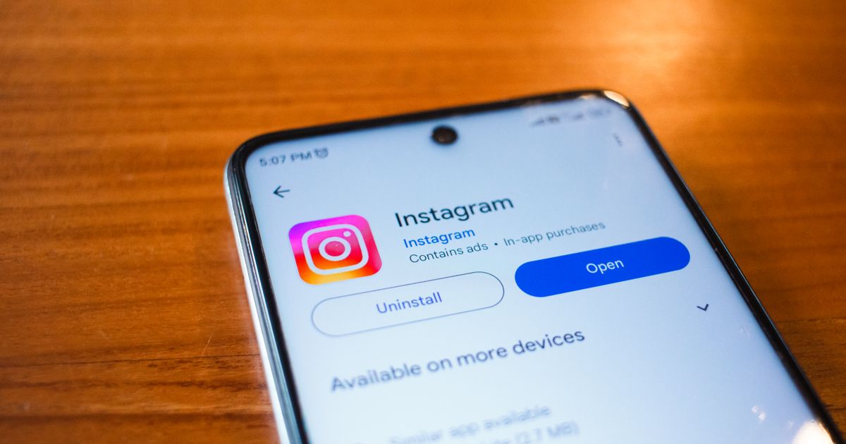 A smartphone with the Instagram app open resting on a table