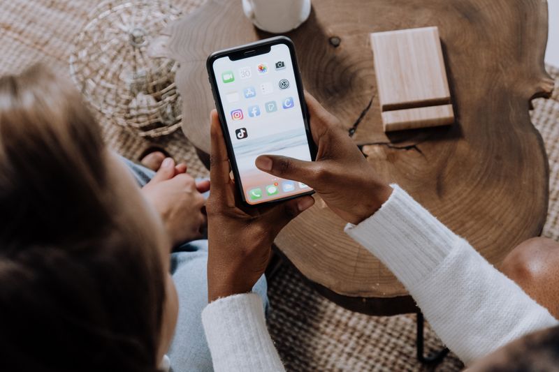 Person holding smartphone showing Instagram app